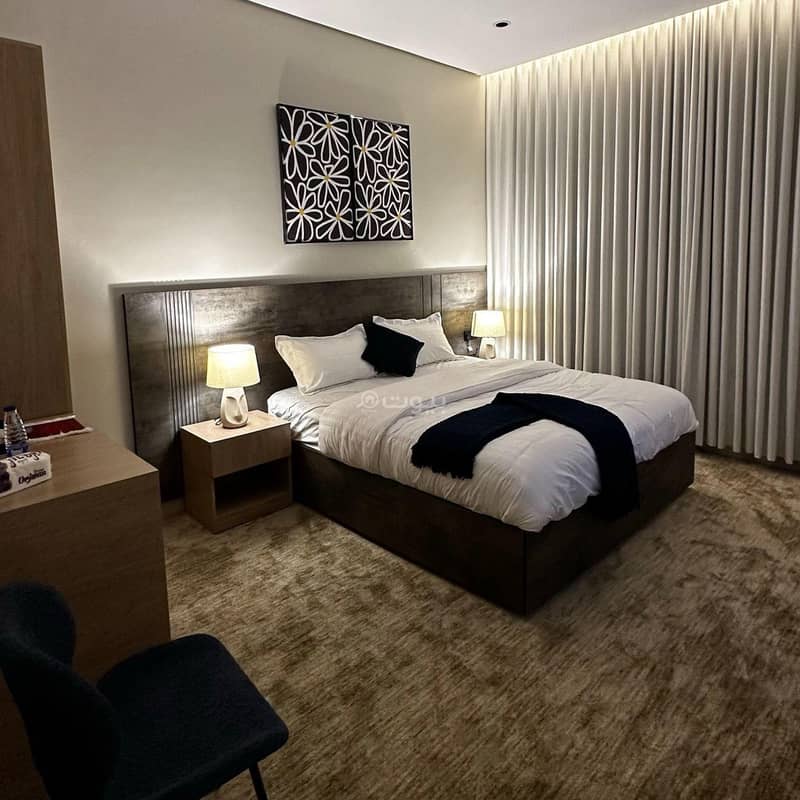 An elegant room with a master bed An elegant room with a master bed