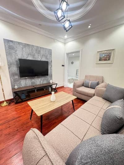 1 Bedroom Flat for Rent in North Jeddah, Jeddah - A living room and a hall in Al-Baghdadiyah neighborhood, close to all services