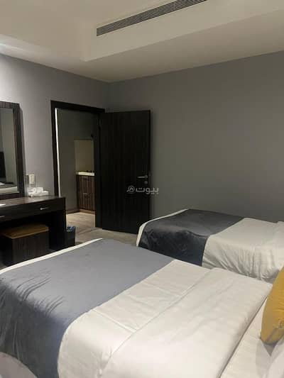 1 Bedroom Flat for Rent in Al Shati Al Sharqi, Dammam - A apartment with one bedroom featuring two separate beds, a living room, kitchen, and a bathroom 1 Bedroom Flat for Rent in Al Shati Al Sharqi, Dammam - A apartment with one bedroom featuring two separate beds, a living room, kitchen, and a bathroom