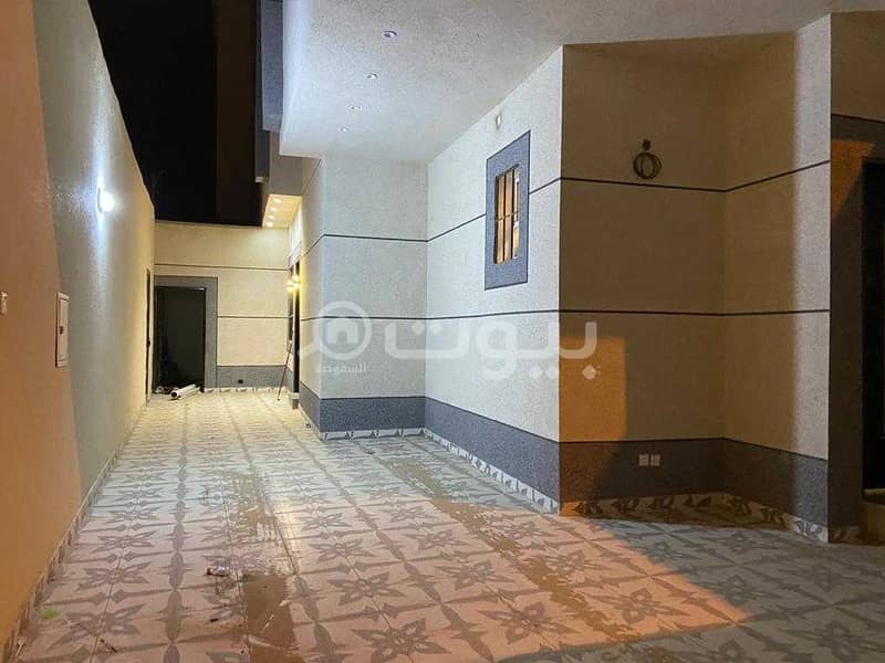 An internal staircase villa and 2 apartments for sale in Al Rimal, East Riyadh