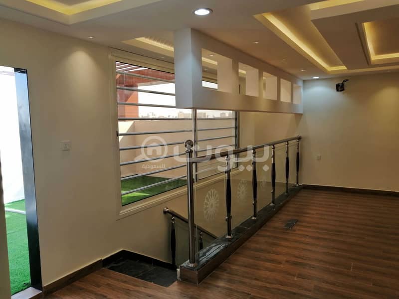 Villa stair in hall and 2 side apartments with park for sale in Al Yarmuk, East of Riyadh