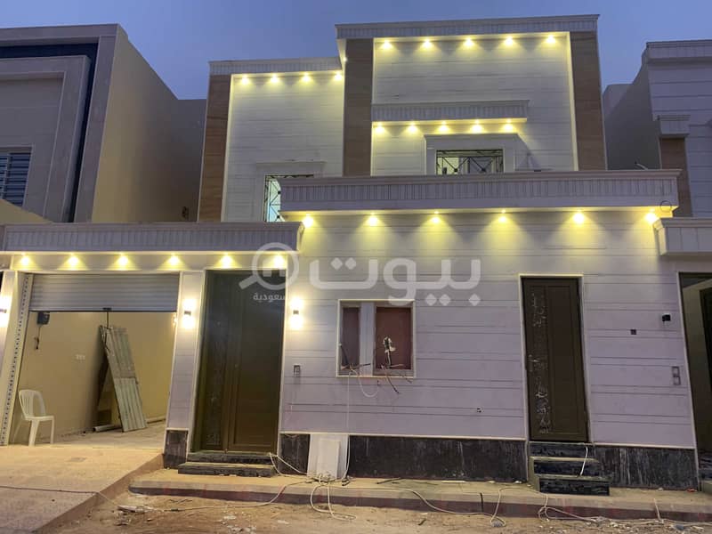 A staircase villa and 2 apartments for sale in Al Qadisiyah, East Riyadh