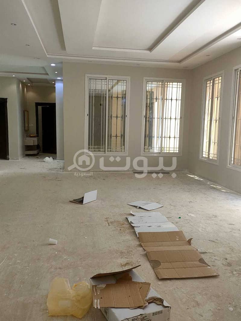 Villa for sale in Al Qadisiyah district, east of Riyadh | Internal stairs and 2 apartments