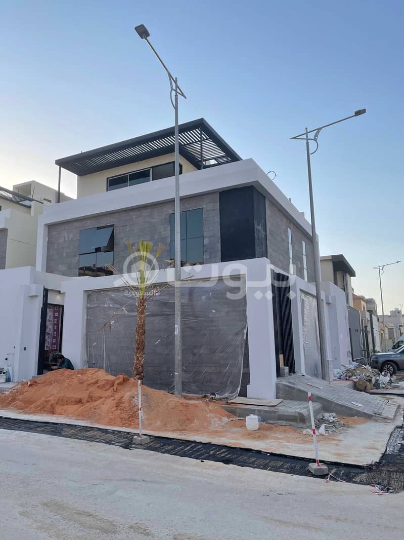 Villa with a rooftop seating area for sale in Al Malqa District, North of Riyadh