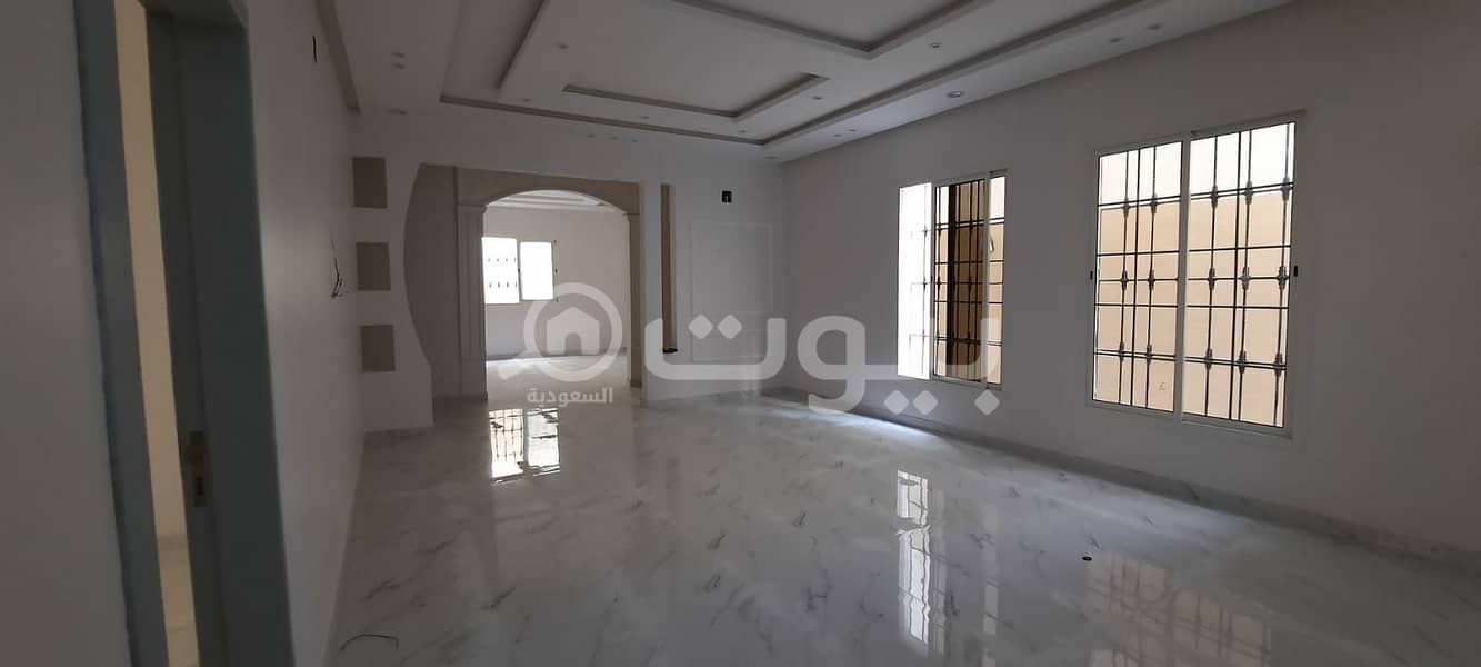 Villa for sale in Tuwaiq district, west of Riyadh | internal stairs and 2 apartments