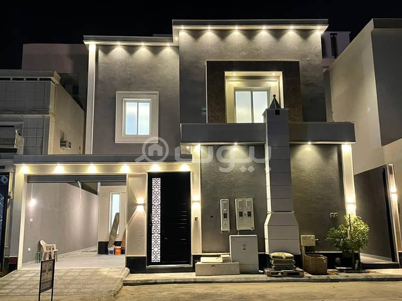 A staircase villa and 2 apartments for sale in Al Rimal, East Riyadh