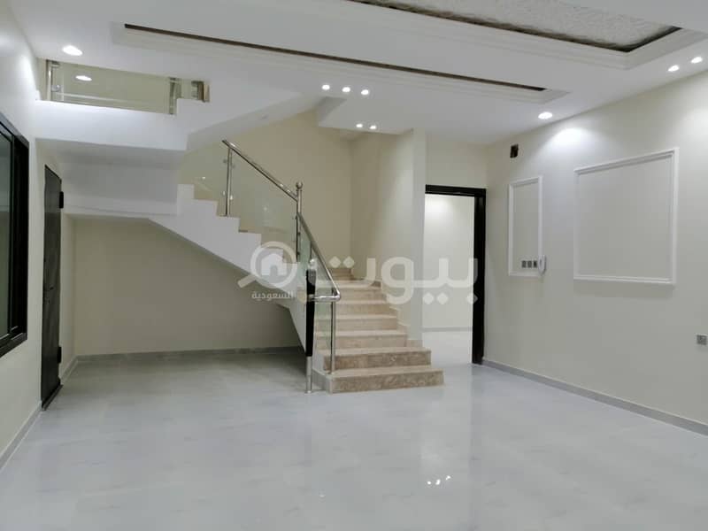 Villa with internal stairs with an apartment for sale in Al Maali scheme in Al Janadriyah district, east of Riyadh