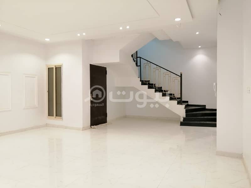 Villa with internal stairs with two apartments for sale in Al-Maali scheme in Al-Janadriyah district, east of Riyadh