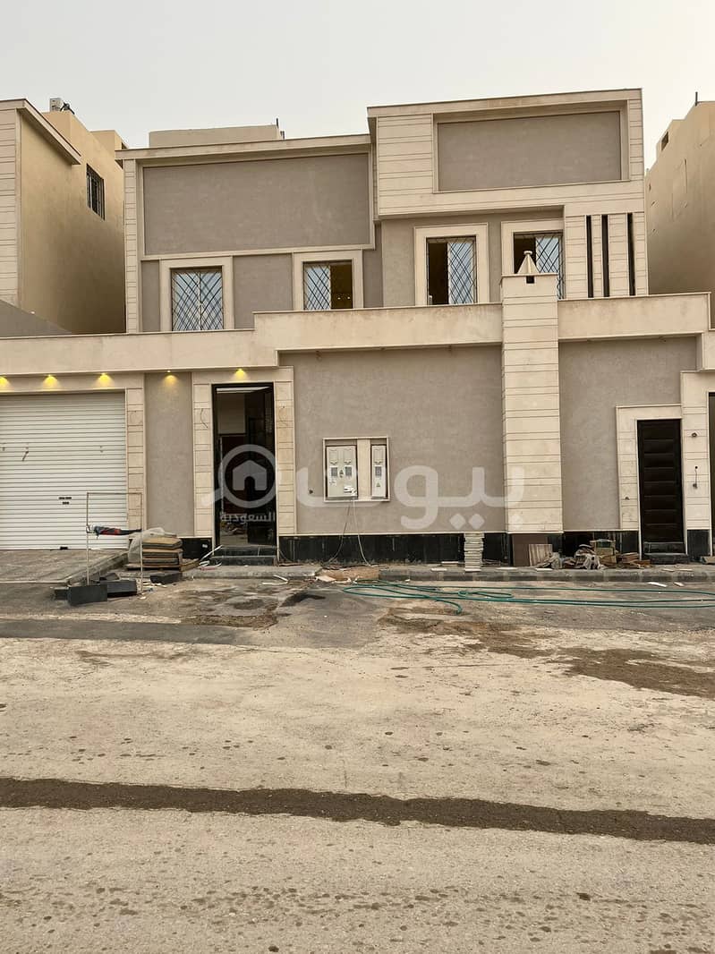 Villa with internal stairs and two apartments for sale in Al-Rimal neighborhood, Ribal scheme, east of Riyadh