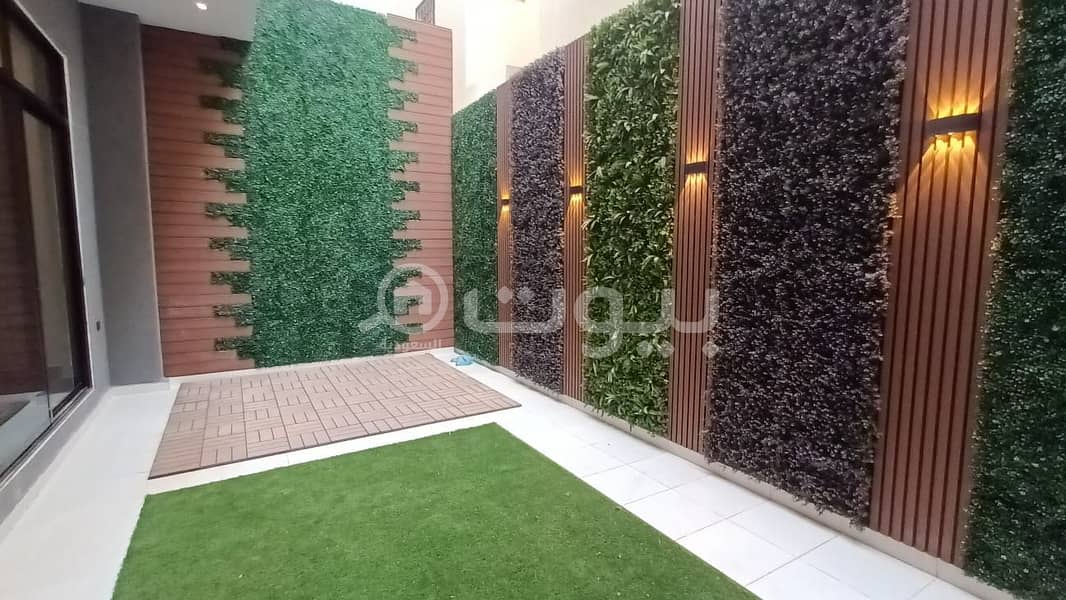 Modern villa with internal stairs and an apartment for sale in Al Munsiyah district, east of Riyadh