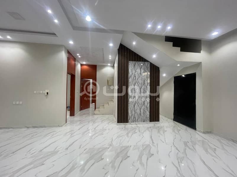 Stairs villa and apartment for sale in Al-Rimal neighborhood, east of Riyadh