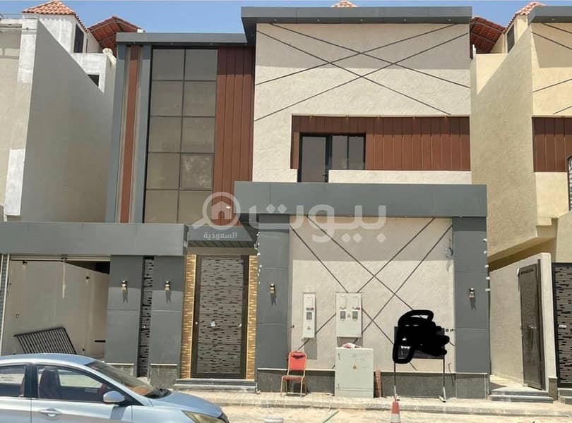 A staircase villa and two apartments for sale in Al Rimal, East Riyadh