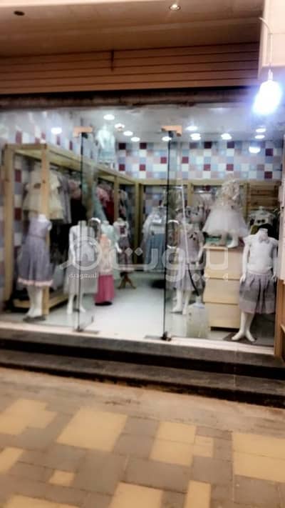 محل تجاري  للبيع في بريدة، منطقة القصيم - محل ملابس اطفال للبيع في الحي الأخضر، الورود