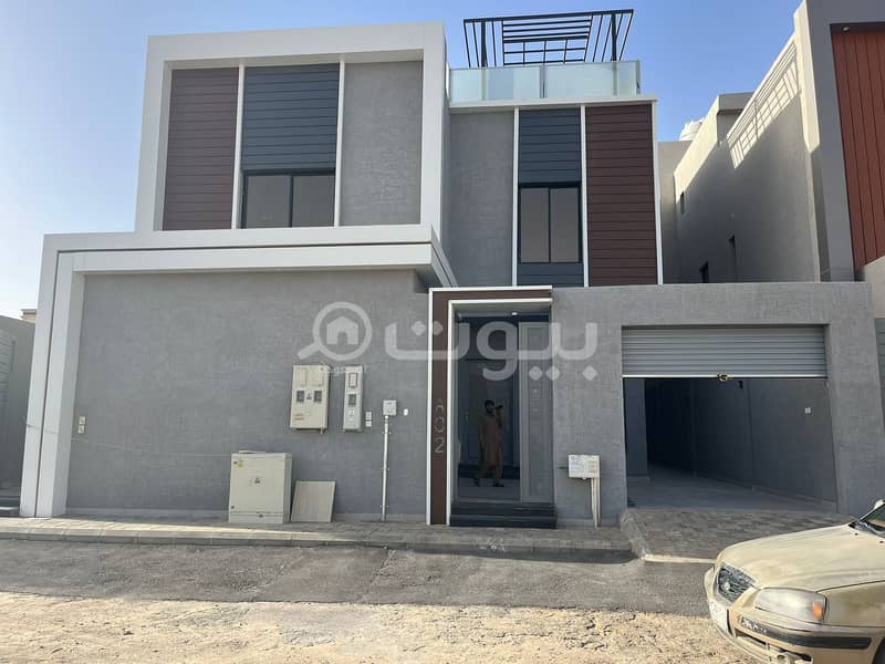 A staircase villa and two apartments for sale in Al-Arid district, north of Riyadh