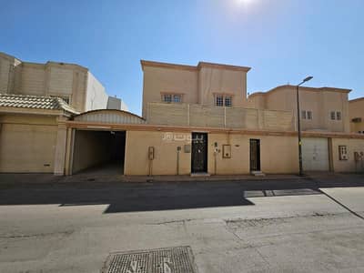 4 Bedroom Villa for Rent in North Riyadh, Riyadh - Two-story villa with stairs and a living room