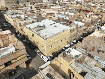 Building for Sale in Central Riyadh, Riyadh - Building for sale on Wadi Al-Laham Street, Manfouha neighborhood