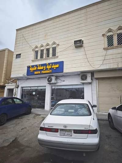 Building for Sale in West Riyadh, Riyadh - Building 7 apartments and 5 shops for sale in Dhahrat Al Badiah, Riyadh