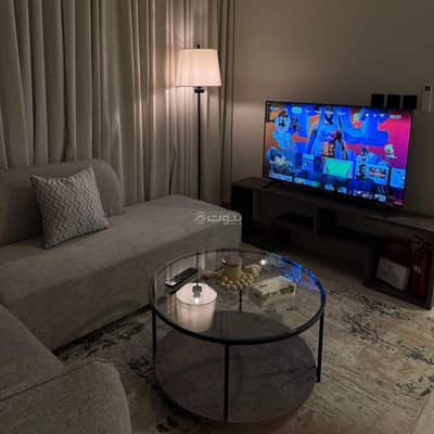 1 Bedroom Flat for Rent in Riyadh - A lounge apartment and a sophisticated bedroom