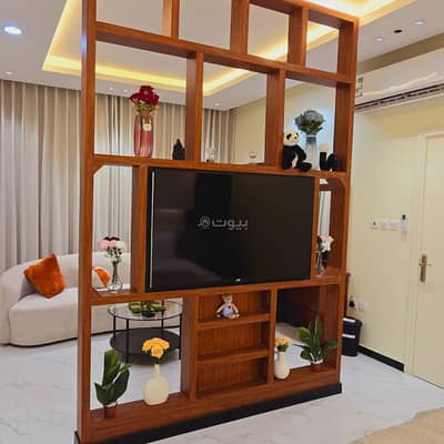 1 Bedroom Apartment for Rent in Riyadh - Quiet studio with a screen on the bed