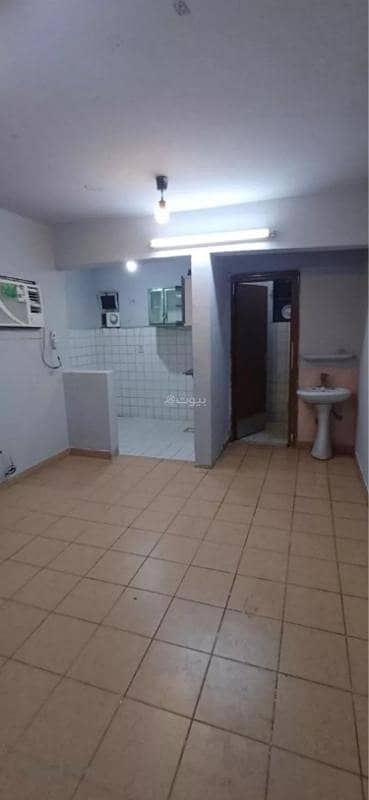 A room, living room, and kitchen for singles in Al-Izdihar neighborhood