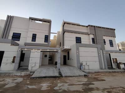 4 Bedroom Villa for Sale in East Riyadh, Riyadh - Villa with a staircase and hall for sale in the Al-Janadriyah neighborhood