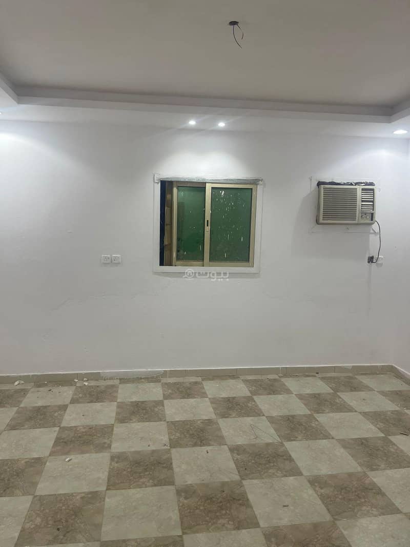Two bedrooms and a living room in Al-Jenadriyah