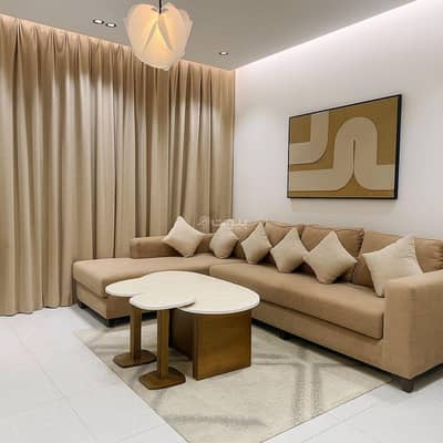 1 Bedroom Apartment for Rent in Jeddah - A room and a lounge with a smart and 75 -inch screen