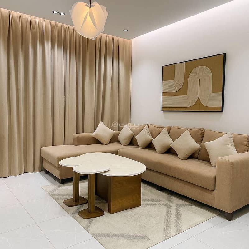 A room and a lounge with a smart and 75 -inch screen