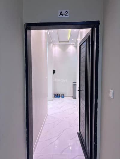 1 Bedroom Flat for Rent in West Riyadh, Riyadh - A spacious one-bedroom apartment with a hall, kitchen, and bathroom.