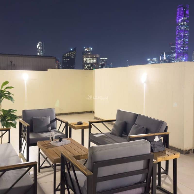 A luxurious apartment with outdoor seating and a charming view