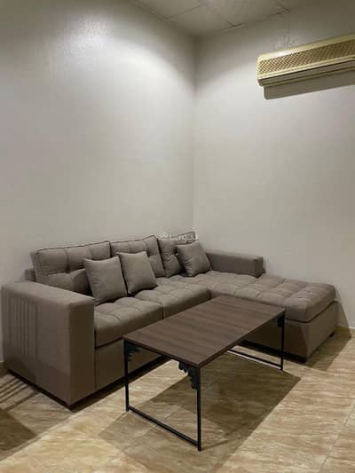 1 Bedroom Flat for Rent in East Riyadh, Riyadh - A one-bedroom apartment with a living room