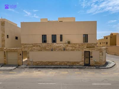 3 Bedroom Villa for Sale in South Riyadh, Riyadh - Corner villa for sale in Badr neighborhood – stone facade and interior staircase design