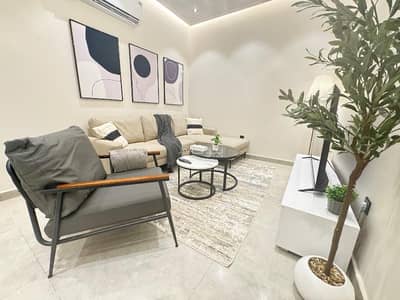 2 Bedroom Flat for Rent in North Jeddah, Jeddah - Luxurious two-bedroom apartment with a 70-inch TV