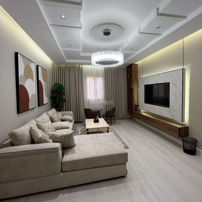A bedroom and a lounge with sophisticated furniture A bedroom and a lounge with sophisticated furniture