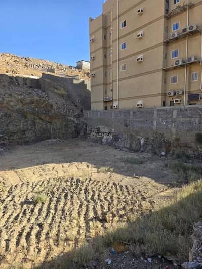 Residential Land for Sale in Wadi Jalil, Makkah - Commercial residential land for sale with two frontages in Wadi Makkah