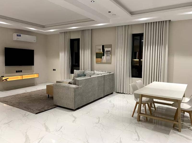 Two-bedroom apartment with a living room, kitchen, and two bathrooms. Two-bedroom apartment with a living room, kitchen, and two bathrooms.
