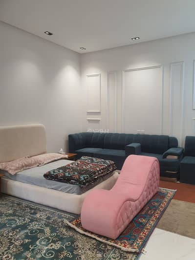 1 Bedroom Apartment for Rent in Riyadh - Self-entry studio with bed and side seating