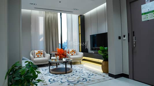 2 Bedroom Flat for Rent in North Riyadh, Riyadh - Two bedrooms and a living room with a garden, a view, and three bathrooms