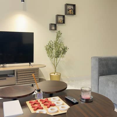 1 Bedroom Apartment for Rent in Al Izdihar, Tabuk - Elegant apartment with a living room and a bedroom with a master bed