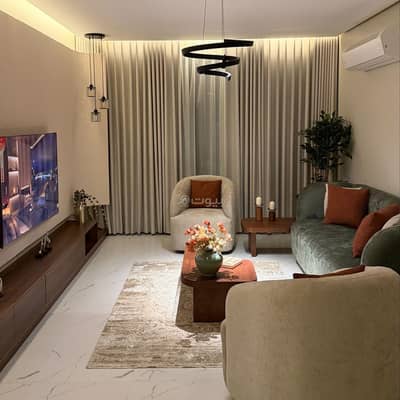 2 Bedroom Flat for Rent in Al Jisr, Al Khobar - Two-bedroom apartment and a living room