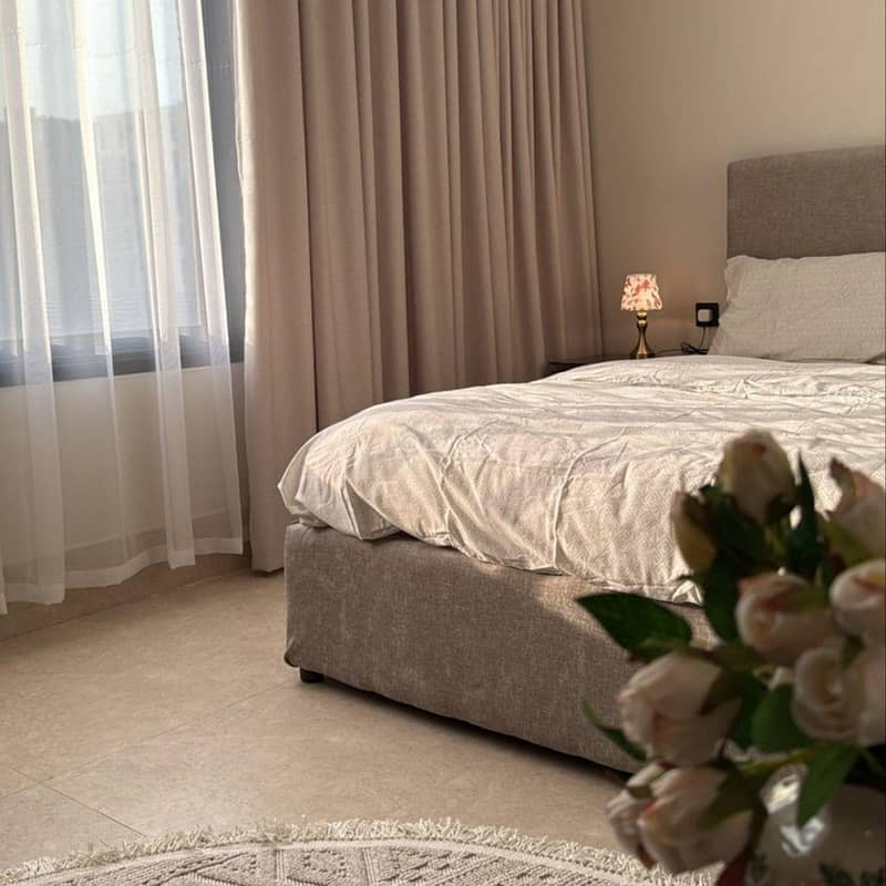 Studio with master bed and side seating Studio with master bed and side seating