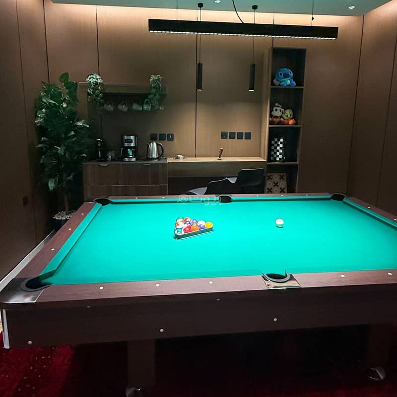 Modern luxury apartment with a billiard table and a bedroom Modern luxury apartment with a billiard table and a bedroom