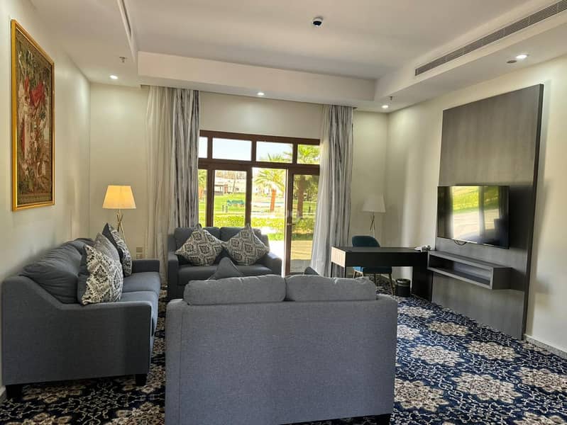 A luxurious suite that includes a hall, a dining area, and a bedroom, view Unit 11 A luxurious suite that includes a hall, a dining area, and a bedroom, view Unit 11