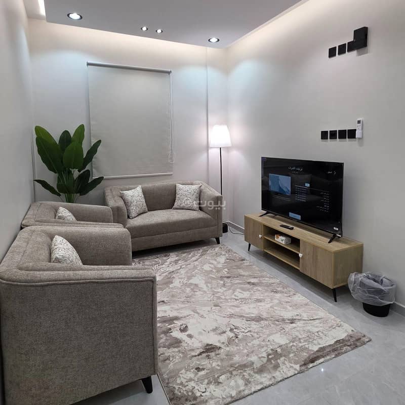 A stylish apartment with a bedroom, a living room, and a bathroom A stylish apartment with a bedroom, a living room, and a bathroom