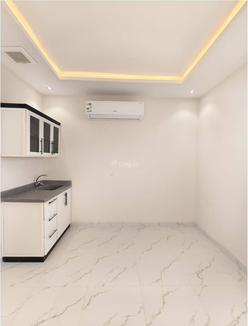 Studio apartment with a room, kitchen counter, and a bathroom Studio apartment with a room, kitchen counter, and a bathroom